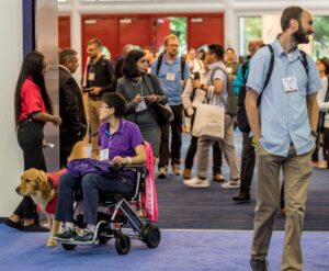 ASHG 2022 Attendee entering the Exhibit Hall