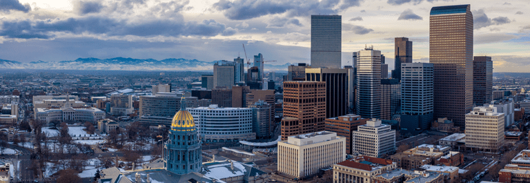 Colorado State Capitol Building & the City of Denver Colorado at Sunset. Rocky Mountains on the Horizon