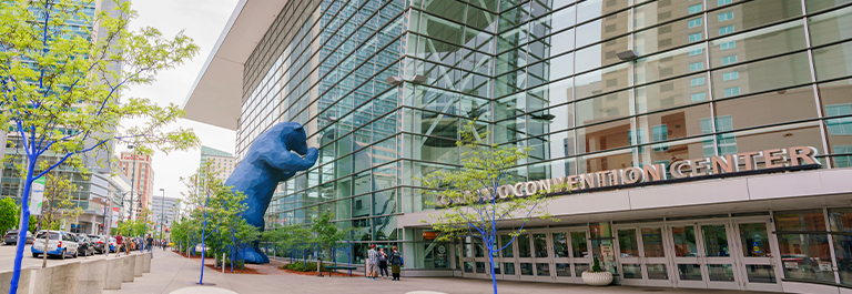 he iconic 40-foot-high Blue Bear "I see what you mean" sculpture peers into Denver's downtown convention center on a late winter morning.